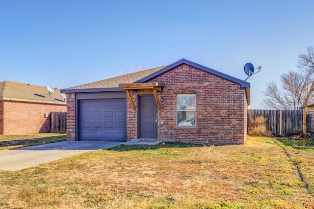 ranch-style house featuring a garage and a front lawn