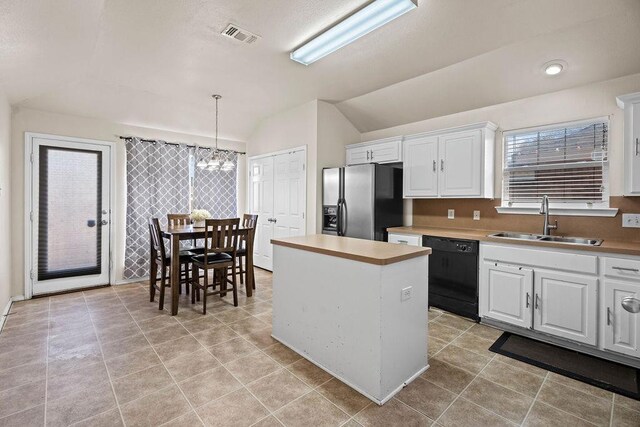 kitchen featuring sink, white cabinetry, stainless steel fridge with ice dispenser, dishwasher, and a kitchen island