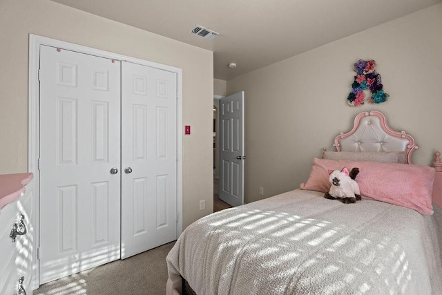 carpeted bedroom with a closet