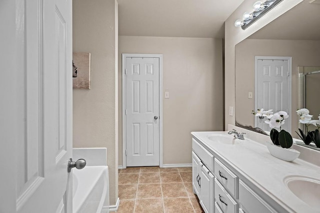 bathroom with vanity, tile patterned floors, and plus walk in shower