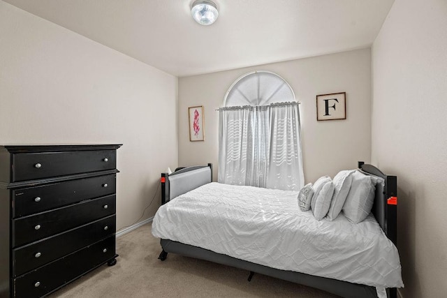 bedroom with light carpet