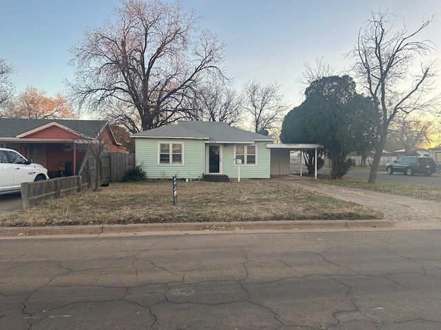 view of front of home featuring a carport