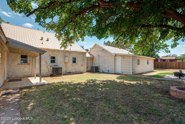 5320 25th St, Lubbock, TX 79407 - view of yard featuring a fire pit, central AC, and a patio area