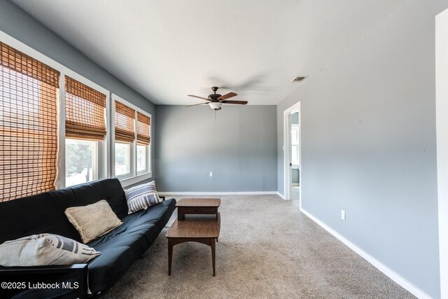 5320 25th St, Lubbock, TX 79407 - living room with a ceiling fan, carpet, and baseboards