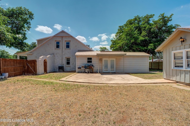 5320 25th St, Lubbock, TX 79407 - rear view of house with french doors, a patio, a gate, and cooling unit