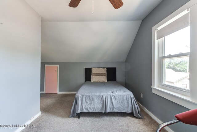 5320 25th St, Lubbock, TX 79407 - bedroom with vaulted ceiling, carpet, baseboards, and ceiling fan