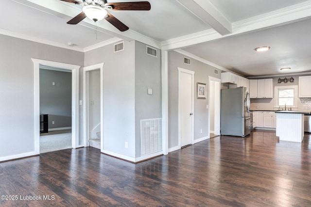5320 25th St, Lubbock, TX 79407 - unfurnished living room with a ceiling fan, a sink, crown molding, dark wood-type flooring, and baseboards
