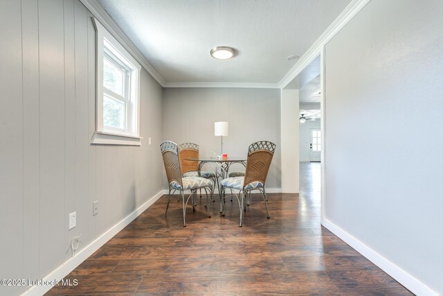5320 25th St, Lubbock, TX 79407 - dining area featuring crown molding, wood finished floors, baseboards, and a ceiling fan