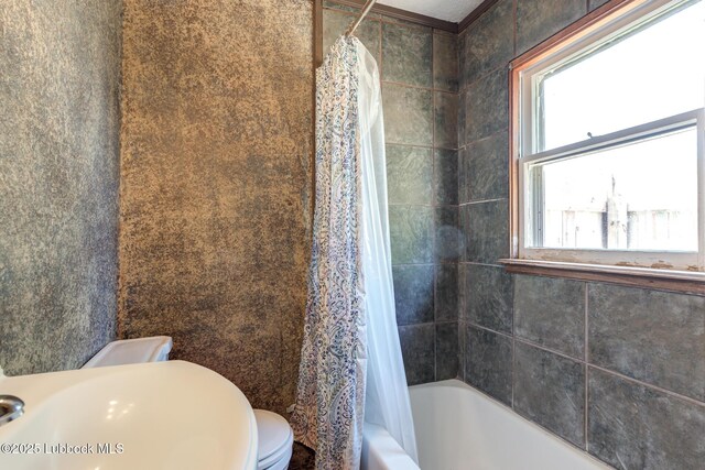 5320 25th St, Lubbock, TX 79407 - full bathroom with toilet, shower / bathtub combination with curtain, and a sink