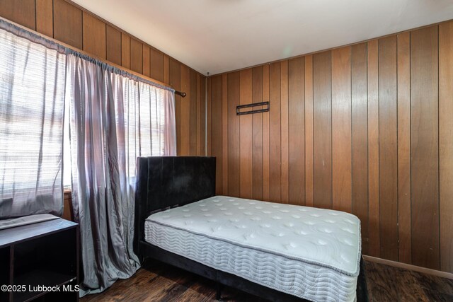 5320 25th St, Lubbock, TX 79407 - bedroom featuring wood finished floors and wood walls