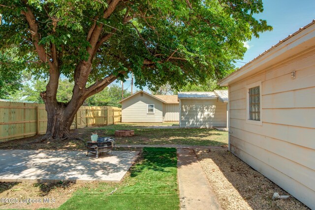 5320 25th St, Lubbock, TX 79407 - view of yard featuring a patio area and an outbuilding