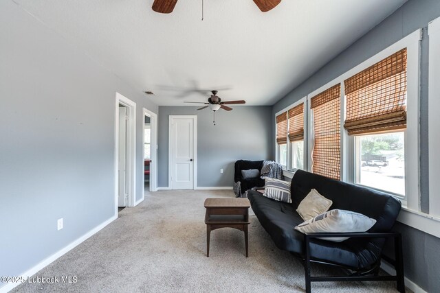 5320 25th St, Lubbock, TX 79407 - carpeted living area with ceiling fan and baseboards