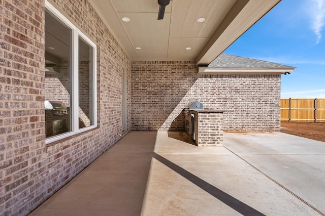 view of patio featuring ceiling fan