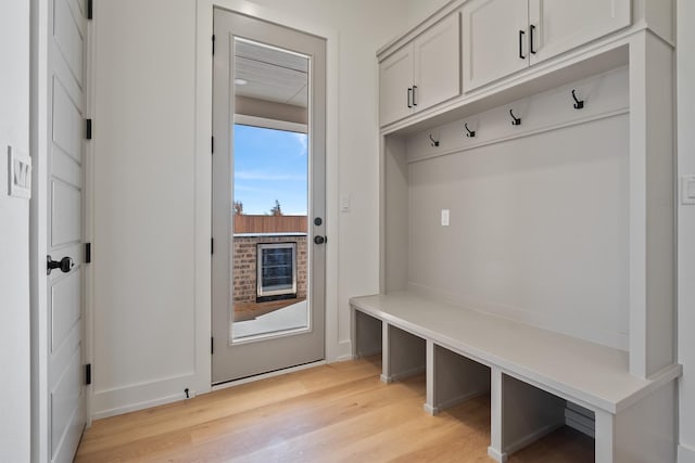 mudroom with light hardwood / wood-style flooring