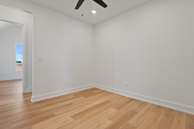 empty room with light hardwood / wood-style floors and ceiling fan