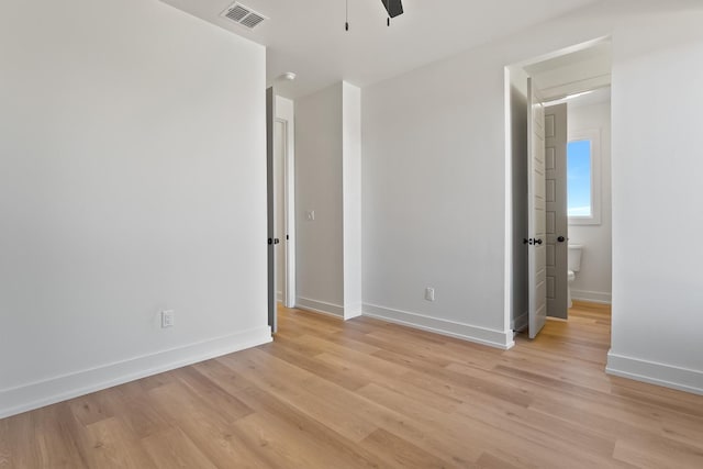 spare room with light hardwood / wood-style flooring and ceiling fan