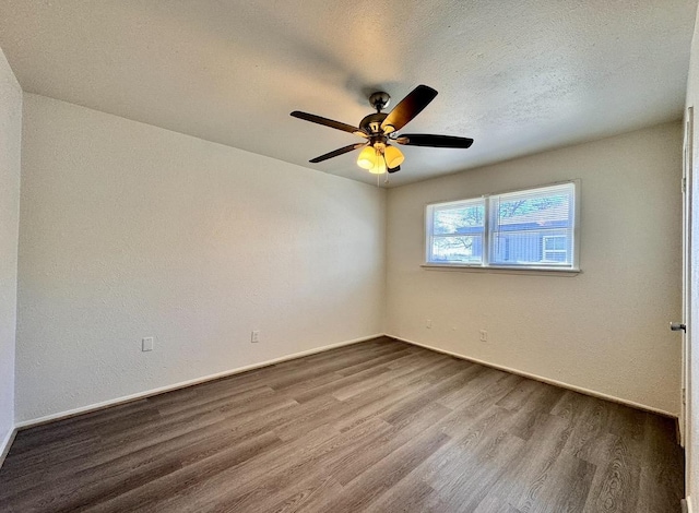 unfurnished room featuring ceiling fan, hardwood / wood-style floors, and a textured ceiling