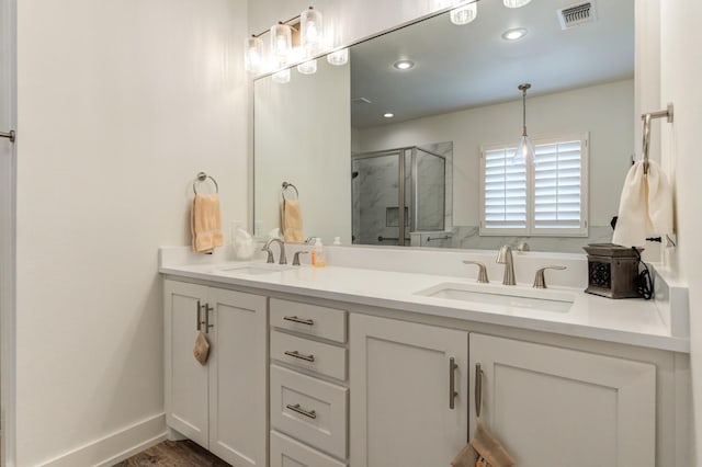 bathroom with vanity and walk in shower