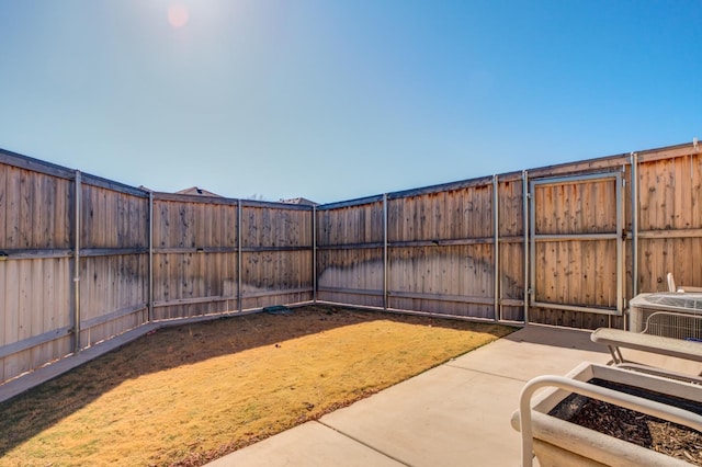 view of yard featuring a patio area and central air condition unit