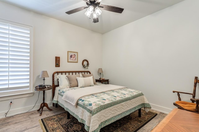 bedroom featuring ceiling fan and wood-type flooring