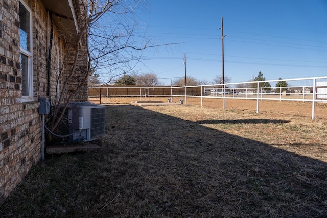 view of yard with cooling unit and volleyball court