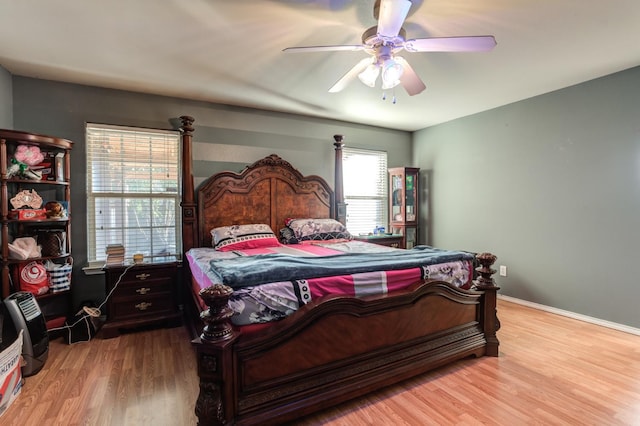 bedroom featuring ceiling fan and light hardwood / wood-style flooring