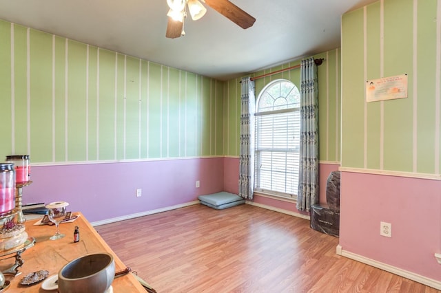 interior space featuring light hardwood / wood-style floors and ceiling fan