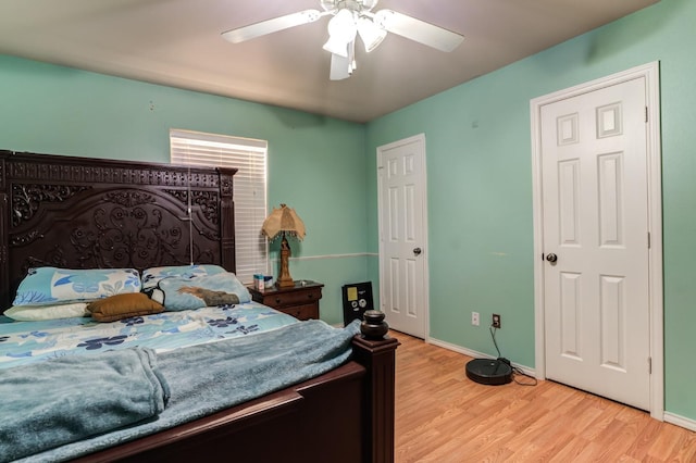 bedroom featuring light hardwood / wood-style flooring and ceiling fan