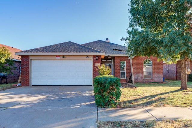 ranch-style home featuring a garage and a front yard