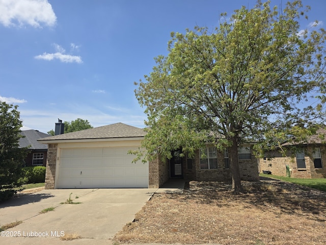 1712 75th St, Lubbock, TX 79423 - obstructed view of property featuring driveway, an attached garage, and brick siding