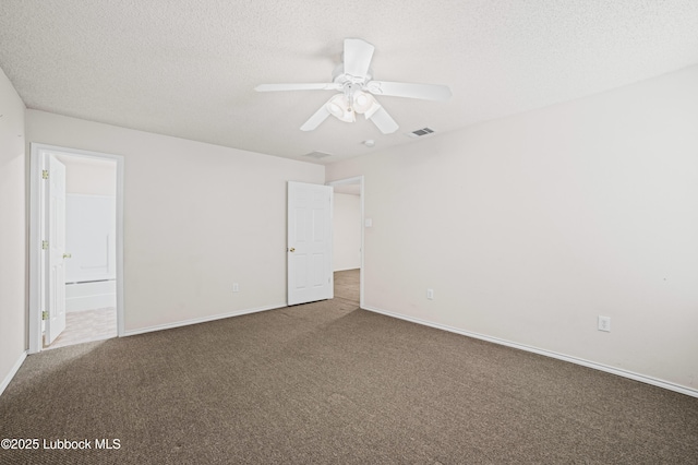 1712 75th St, Lubbock, TX 79423 - carpeted spare room featuring baseboards, a textured ceiling, and ceiling fan