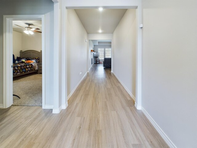 corridor featuring light wood-type flooring