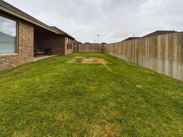 view of yard with a patio area