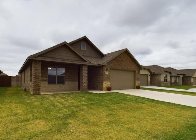 view of front of house featuring a garage and a front lawn