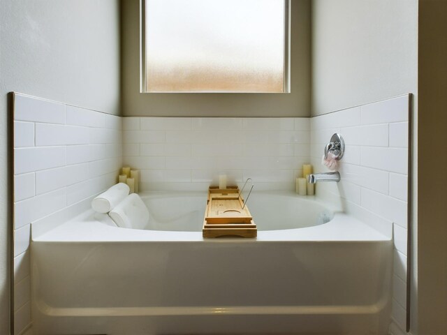 bathroom with a bathing tub