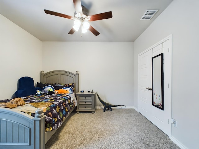 carpeted bedroom with ceiling fan