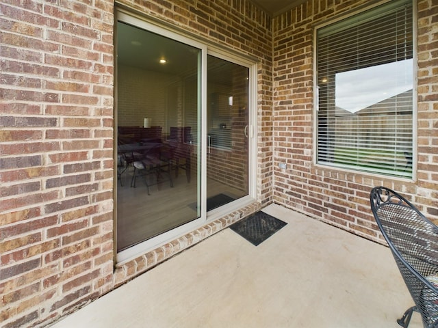 doorway to property with a patio area