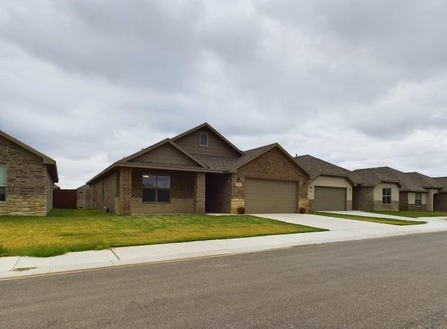 view of front of house with a garage and a front lawn