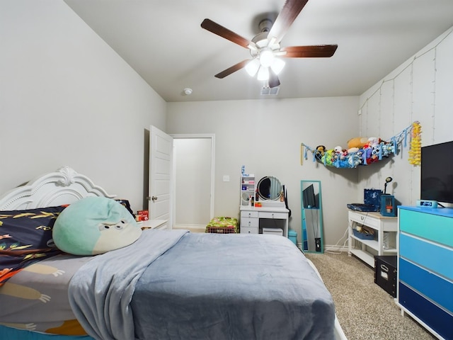 bedroom featuring ceiling fan and light carpet