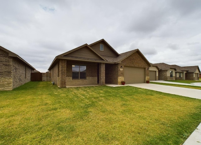 view of front of house with a garage and a front lawn