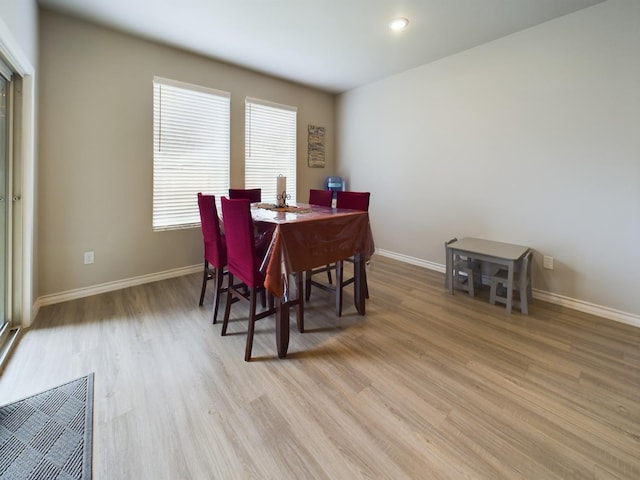 dining space featuring light wood-type flooring