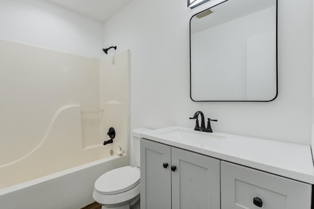 full bath with shower / bathtub combination, toilet, and vanity