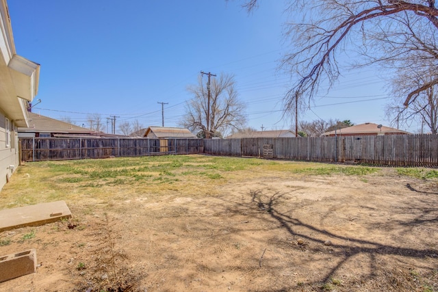 view of yard featuring a fenced backyard