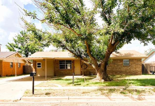 ranch-style house with a carport