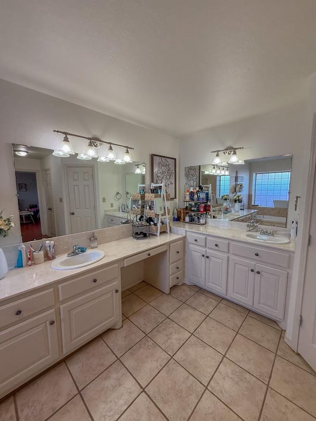 bathroom with tile patterned flooring and vanity