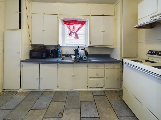 kitchen with white range with electric cooktop, dark countertops, decorative backsplash, black microwave, and under cabinet range hood