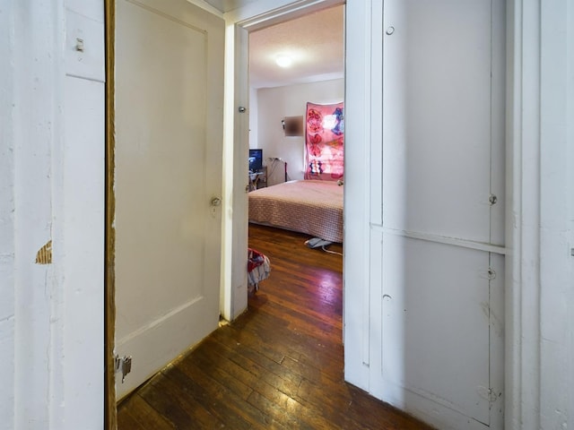 hall with hardwood / wood-style floors