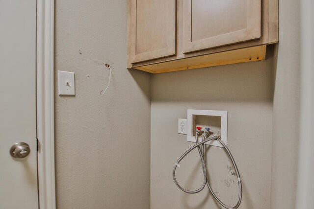 6205 21st St, Lubbock, TX 79407 - laundry room with cabinet space and washer hookup