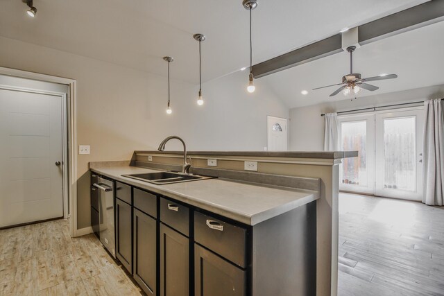 6205 21st St, Lubbock, TX 79407 - kitchen featuring a peninsula, a ceiling fan, light wood finished floors, pendant lighting, and light countertops