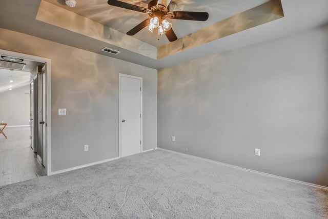 6205 21st St, Lubbock, TX 79407 - carpeted spare room with a tray ceiling and a ceiling fan